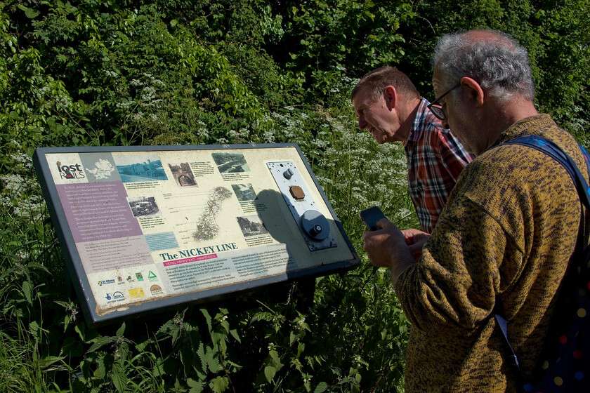 Andy & Mike, reading signage 
 Throughout the length of the Nickey Line Walk there was plenty of clear signage and lots of information about the route. As we take a pause on our walk Mike and Andy take in further information. It is alleged that the name Nickey is a derivation of Lickey (as in the incline) due to the steep, varying and sharp gradients on the route between Harpenden and Hemel Hempstead; something we can certainly vouch for on our walk! The gradient profile reveals a section of 1:37 (the same as Lickey) and two longer sections of 1:39. 
 Keywords: Andy Mike, reading signage