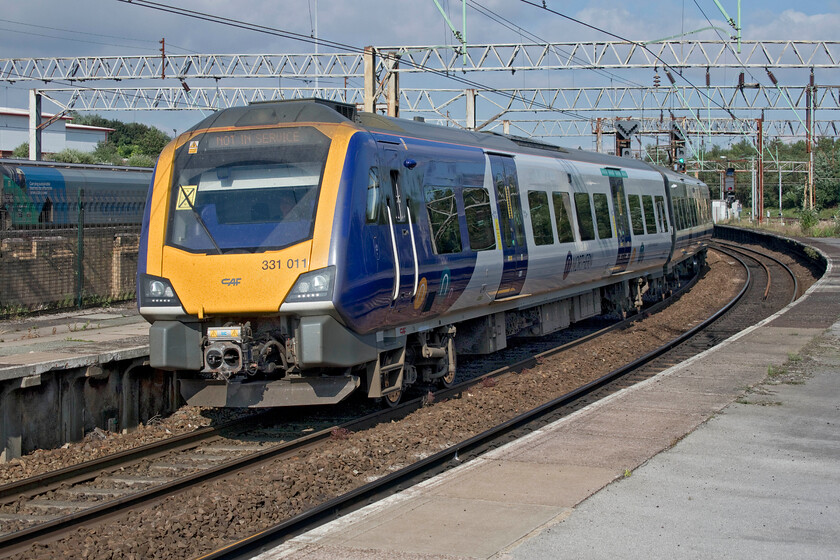 331011, unidentified ECS working, Edge Hill station 
 Despite all the technology and information at my disposal, I have failed to identify this, what appears to be judging by its display screen, an ECS working. Northern's Civity 331011 passes slowly through Edge Hill station heading for Liverpool Lime Street. 
 Keywords: 331011, unidentified ECS working, Edge Hill station Civity