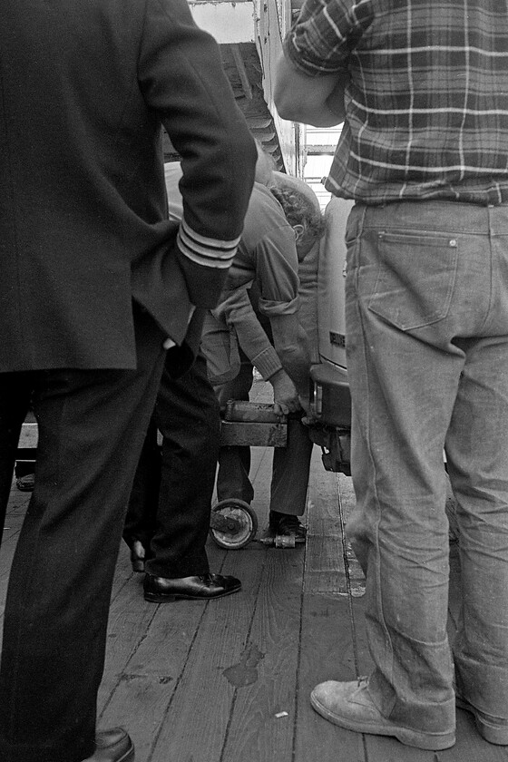 Loading MV Farringford, New Holland Pier 
 How many Sealink employees does it take to unhitch a trailer from a Sherpa van? However, I forgive them in their joint endeavours and perhaps perceived lack of efficiency as these crew members aboard the MV Farringford had only another week in their jobs as the ferry was to cease operations in a week's time with the opening of the Humber bridge. 
 Keywords: Loading MV Farringford New Holland Pier Sealink