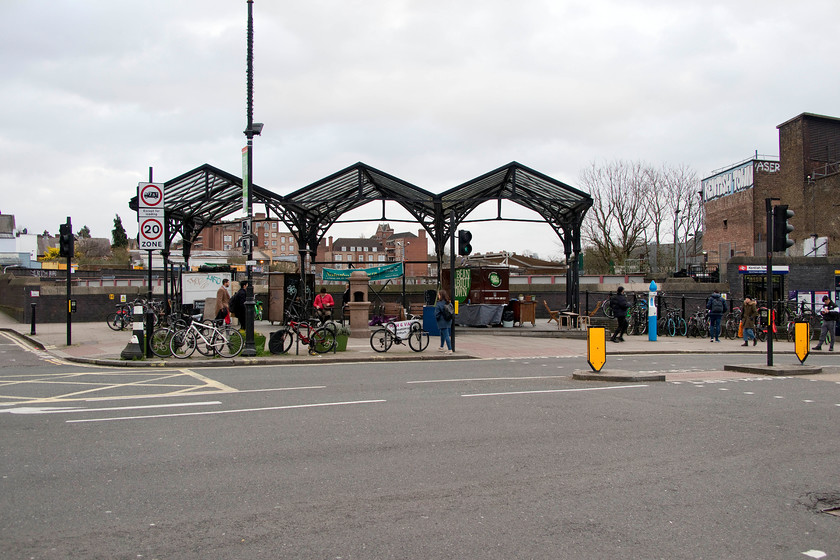 Frontage, Kentish Town station 
 This may seem a strange photograph to take and include but by way of a comparison with my 1979 image it is very interesting, see..... https://www.ontheupfast.com/v/photos/21936chg/27444294204/frontage-kentish-town-station All vestiges of the previous station have been obliterated with access now via the small entrance to the far right that in turn links into the Northern Line underground station and a new access bridge to all platforms. 
 Keywords: Frontage Kentish Town station