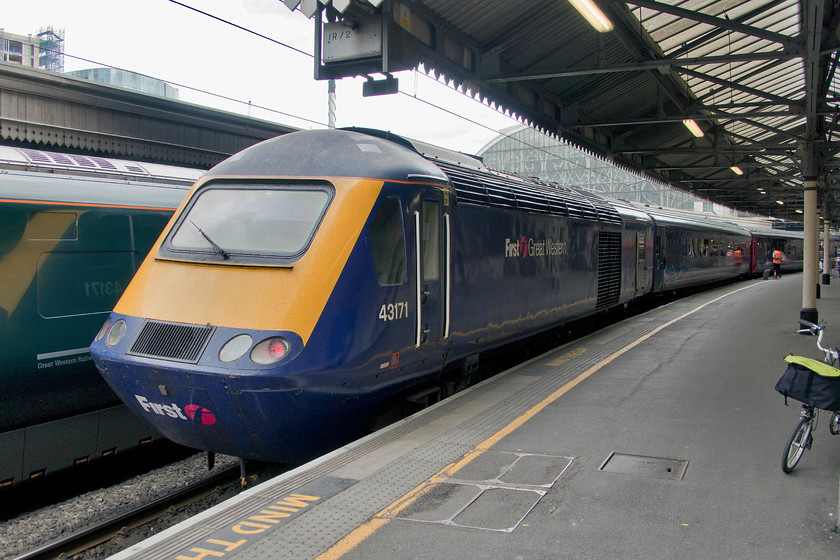 43171, GW 14.03 London Paddington-Penzance (1C84, 2E), London Paddington station 
 One of my most photographed HST power cars, 43171, sits at the head of the 14.03 to Penzance at Paddington station approximately half an hour before its departure. This could well be my last picture of an HST at Paddington station as they are to be finally withdrawn from the western routes in two weeks time and I am unlikely to return in that time. Notice Bertie the Brompton putting in an appearance to the far right of the picture! 
 Keywords: 43171 14.03 London Paddington-Penzance 1C84 London Paddington station