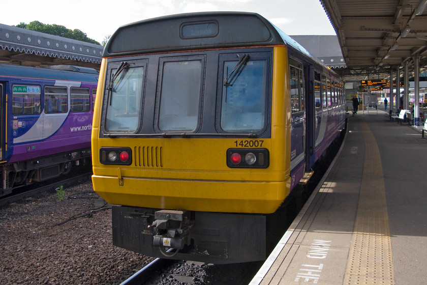 142007, 09.06 Sheffield-Leeds (2L18), Sheffield station 
 Having arrived at Sheffield, my boss and I alighted from the Meridian that had brought us up from Wellingborough and prepared ourselves for a bit of Pacer action! 142007 waits at Sheffield's platform 3A from where it will form the 09.06 to Leeds. We took this train as far as Wakefield Kirkgate stopping at every intermediate station. 
 Keywords: 142007 09.06 Sheffield-Leeds 2L18 Sheffield station Pacer Northern Rail