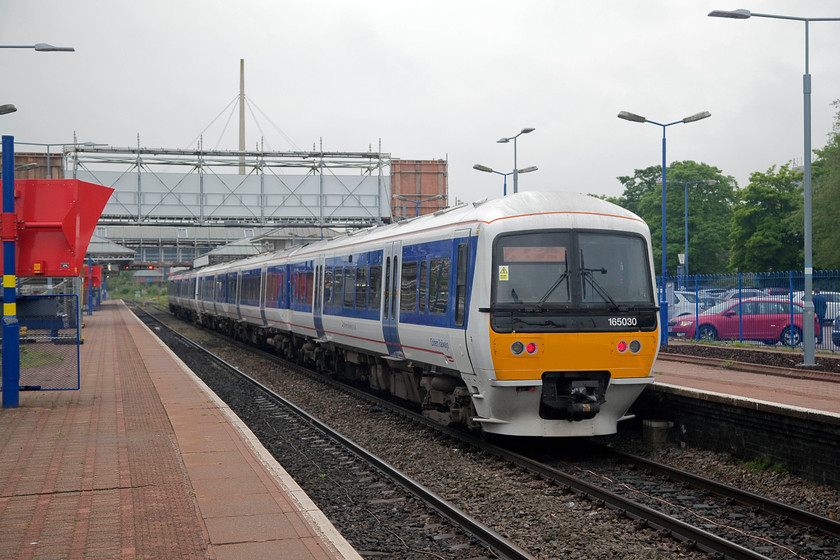 165030 & 165028, CH 07.41 Aylesbury-London Marylebone (2C15, 1L), Aylesbury station 
 Having come in as an ECS working, 165030 and 165028 wait to leave Aylesbury station with the 07.41 to London Marylebone. Aylesbury was on the Great Central line from Nottingham to London and was a busy station. After the GC shut it became a bit of an outpost and was even considered for closure. It has gone through a considerable renaissance and it's likely that this will continue when (if?) the East-West rail link opens allowing direct trains to operate from Aylesbury (and further south) to Milton Keynes and beyond. 
 Keywords: 165030 165028 2C15 Aylesbury station