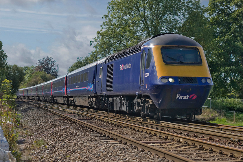 43093, GW 11.30 Paignton-London Paddington (1A82), Blatchbridge Junction 
 HST power car 43093 leads the 1A82 11.30 Paignton to Paddington past Blatcbridge Junction just south of Frome. By a quite remarkable coincidence, I visited the Frome area on this same day thirty-six years ago and took a virtually identical photograph from the security of the foot crossing, see.... https://www.ontheupfast.com/p/21936chg/27043799604/x50015-10-05-paignton-london-paddington - what are the chances of that I wonder? 
 Keywords: 43093 11.30 Paignton-London Paddington 1A82 Blatchbridge Junction FGW First Great Western HST