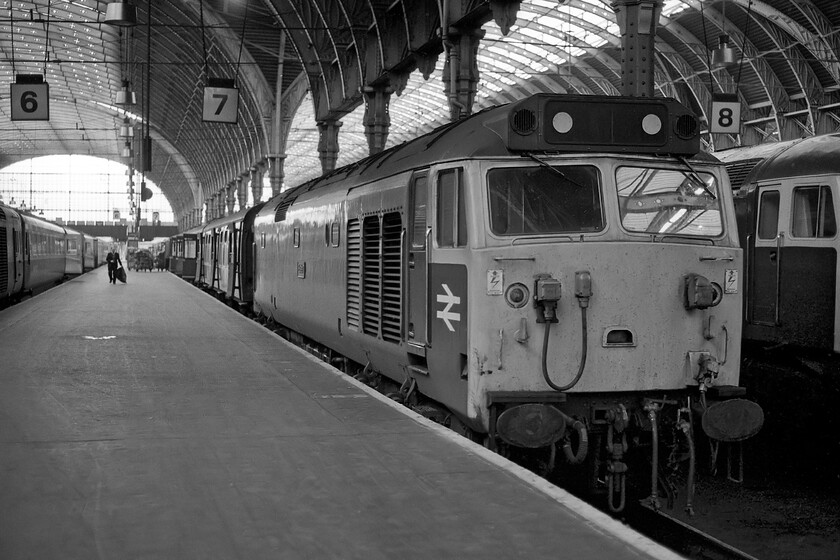 50044, 16.30 Oxford-London Paddington (1A33), London Paddington station 
 On arrival back at Paddington station, I was greeted by a number of Class 50s on the blocks having worked services in from the west. 50044 'Exeter' had arrived with the 1A33 16.30 'fast' from Oxford and would soon be released to then work the 17.52 'Westbury Express' that we took home. Notice the HST to the left and the Class 47 to the right neither of which attracted the attention of my lens or even my notebook for that matter, how things would change over the years to come! 
 Keywords: 50044 16.30 Oxford-London Paddington 1A33 London Paddington station Exeter Class 50