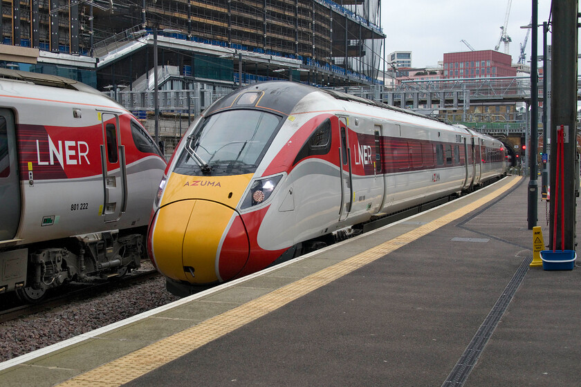 801122, GR 12.00 Edinburgh Waverley-London King's Cross (1E14, 3E) & 800108, GR 09.52 Aberdeen-London King's Cross (1E15, 2L), London King's Cross station 
 To the left in this photograph, 801122 is being prepared for its next journey north after arriving a little earlier with the 1E14 12.00 ex Edinburgh Waverley. Meanwhile, 800108 is in the last few yards of its five hundred and twenty-three-mile journey from Aberdeen from where it left at 09.52 running as 1E15 
 Keywords: 801122 12.00 Edinburgh Waverley-London King's Cross 1E14 800108 09.52 Aberdeen-London King's Cross 1E15 London King's Cross station LNER Azuma