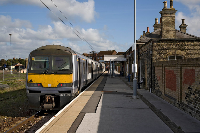 321320, LE 09.28 Harwich Town-Manningtree (2A27), Harwich Town station 
 Having just arrived with the 09.00 service from Manningtree 321320 will soon work the 09.28 return service. The train is seen standing at Harwich Town's sole platform with the rather grand station building to the right. The status of this station is somewhat diminished from what it once was when Harwich town once boasted its own port facilities that included the loading of complete trains on to ferries to cross to the continent. This was until ferry services moved to the nearby and much larger Parkstone Quay. 
 Keywords: 321320 09.28 Harwich Town-Manningtree 2A27 Harwich Town station Mayflower Line