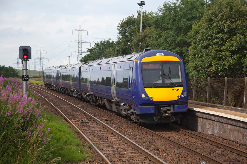 170417, SR 09.50 Edinburgh Waverley-Glenrothes with Thornton (2G49, 1E), Longelly station 
 170417 comes to halt atone of the split platforms at Longelly forming the 09.50 Edinburgh Waverley to Glenrothes with Thornton service. The Fife Circle route enjoys a regular service with a number of stopping patterns. During the morning and evening peak times, it also receives two locomotive-hauled services, something that has been in operation for a number of years now. 
 Keywords: 170417 SR 09.50 Edinburgh Waverley-Glenrothes with Thornton 2G49 Longelly station