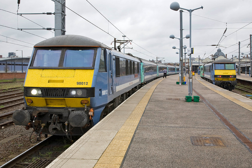 90012, LE 15.30 Norwich-London Liverpool Street (1P49) & 90010, LE 16.00 Norwich-London Liverpool Street (1P51), Norwich station 
 To the left in this view on Norwich station is 90012 'Royal Anglian Regiment' that is just leaving a minute or two late with the 1P49 15.30 departure to Liverpool Street. To the right, 90010 'Bressingham Steam & Gardens' will lead the 16.00 departure with the stock currently being prepared by the train care team. 
 Keywords: 90012 15.30 Norwich-London Liverpool Street 1P49 90010 Bressingham Steam & Gardens 16.00 Norwich-London Liverpool Street 1P51 Norwich station Abellio Greater Anglia Royal Anglian Regiment