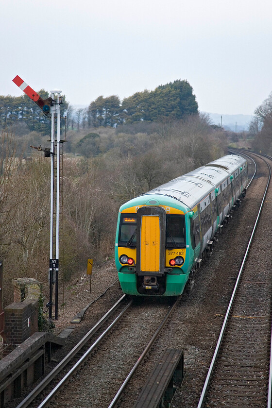 377462, SN 17.30 Bognor Regis-London Victoria, Amberley station 
 Electrostar 377462 leaves Amberley station deep in the beautiful Arun Valley. The station is just a few yards from the River Arun along which the county boundary between West Sussex and Hampshire runs. The 17.30 Bognor to Victoria service passes the unusually tall Amberley up home signal thats raised height enables drivers to get a clear view of the arm above the station's footbridge on which I am standing. 
 Keywords: 377462 17.30 Bognor Regis-London Victoria Amberley station