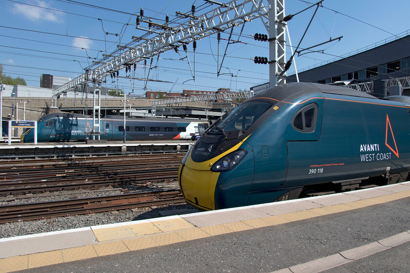 390118, VT 13.30 London Euston-Glasgow Central (1S69, 102L) & 390136, VT 14.30 London Euston-Glasgow Central (Cancelled from Carlisle) (1S72, 14L), London Euston station 
 Two Anglo Scottish Avanti Pendolinos stand at London Euston in the afternoon spring sunshine. In the background 390136 will work the 14.30 departure whilst in the foreground 390118 will leave soon at 13.30. Unfortunately, for both these trains, things went horribly wrong later in their journeys due to overhead supply problems in the Borders. The 13.30 service made it to Glasgow with an eye-watering one hundred and two minutes of delay whilst the 14.30 service was cancelled at Carlisle. I presume passengers heading beyond Carlisle were transferred to services taking the G&SW route via Dumfries 
 Keywords: 390118 13.30 London Euston-Glasgow Central 1S69 390136 14.30 London Euston-Glasgow Central 1S72 London Euston station Avanti West Coast pendolino