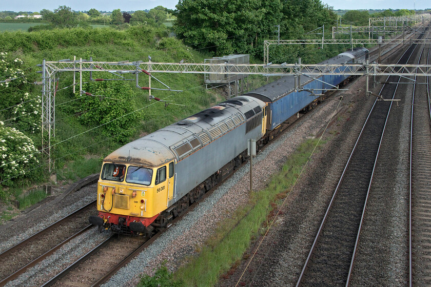 56081 & 56091, 17.00 Wembley Depot-Leicester LIP (5F90, 20E), Victoria bridge 
 A rather tatty 56081 leads a couple of barrier coaches past Victoria bridge just south of Roade in Northamptonshire. The Class 56, dating from the summer of 1980, is leading the 17.00 Wembley Depot to Leicester LIP move running as 5F90. Just visible at the rear of the short train is 56091 'Driver Wayne Gaskell The Godfather' 
 Keywords: 56081 56091 17.00 Wembley Depot-Leicester LIP 5F90 Victoria bridge Driver wayne gaskell the godfather