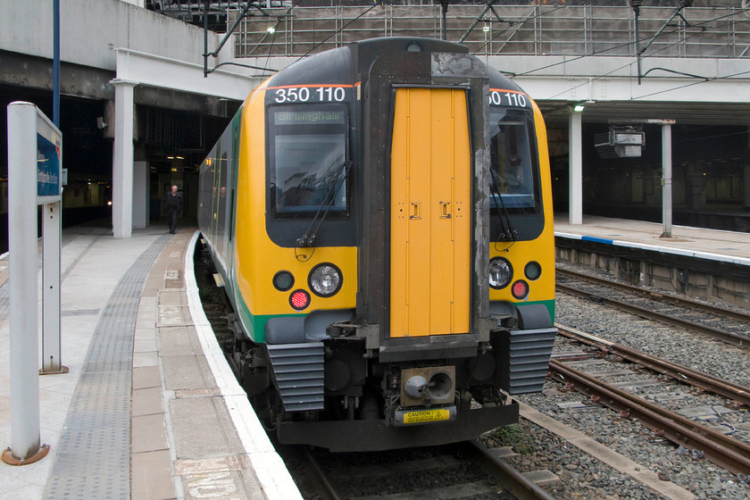 350110, LM 12.14 Birmingham New Street-London-Euston (2Y13), Birmingham New Street station 
 Our train home to Northampton is seen at Birmingham New Street with the driver walking towards the front to of the train. 350110 will work the 12.14 to London Euston. 
 Keywords: 350110 12.14 Birmingham New Street-London-Euston 2Y13 Birmingham New Street station