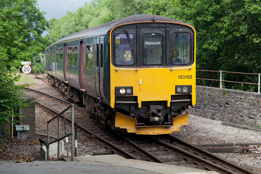 150102, GW 09.29 Gunnislake-Plymouth (2P83, 1E), Bere Alston station 
 150102 drifts into Bere Alston station forming the 09.29 Gunnislake to Plymouth service. After arrival, the train then reverses to continue its journey via the line branching off to the left. 
 Keywords: 150102 2P83 Bere Alston station