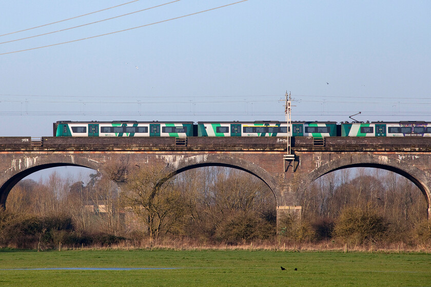 350370, LN 06.24 Crewe-London Euston (1U16, 5L), Haversham SP818425 
 Approaching Wolverton (but not stopping as it's a fast service) 350370 crosses Haversham viaduct that itself spans the valley of the River Great Ouse working the 1U16 06.24 Crewe to Euston service. Notice the paintwork in the centre of the third carriage of the four-car set that is in fact not a graffiti attack but part of a vinyl advertising Cadbury World! 
 Keywords: 350370 06.24 Crewe-London Euston 1U16 Haversham SP818425 London Northwestern Desiro