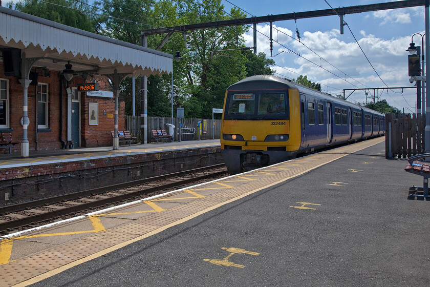 321484, GA 14.02 London Liverpool Street-Ipswich (1Y20, 2E), Ingatestone station 
 The ultimate in lazy railway photography taken from the luxury of a platform bench! I was enjoying a coffee and a snack whilst 321484 passed with the 14.02 London Liverpool Street to Ipswich 1Y20 service. It is the little things like the small yellow-painted social distancing reminders on the platform that we will forget when the pandemic becomes a thing of the past in a few years time! 
 Keywords: 321484 14.02 London Liverpool Street-Ipswich 1Y20 Ingatestone station Greater Anglia Dusty Bin