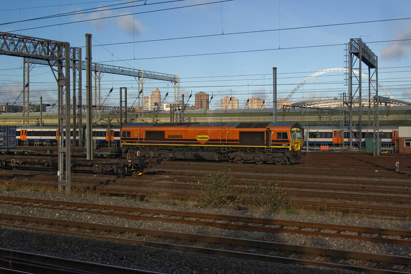 66415, 05.54 Trafford Park-Tilbury FLT (4L44, RT), Wembley Yard 
 The 4L44 05.54 Trafford Park to Tilbury Freightliner service has recently arrived at Wembley Yard hauled by 66415 'You Are Never Alone'. This service is often electric hauled but not today with one of Freightliner's bright Genesee & Wyoming liveried Class 66s leading. 
 Keywords: 66415 05.54 Trafford Park-Tilbury FLT 4L44 Wembley Yard Freightliner You are never alone