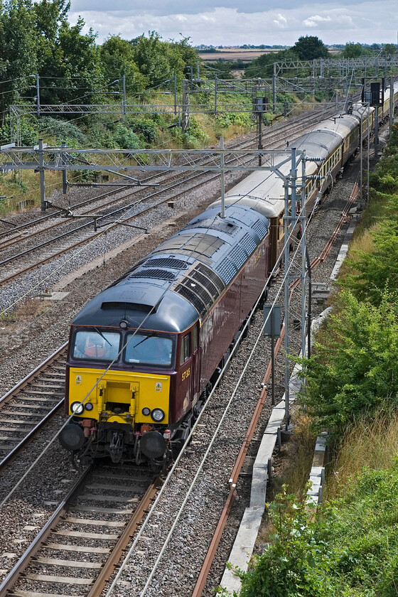 57315, Acton Lane-Carnforth ECS (5Z67), Victoria bridge 
 Unusually taking the down fast line, thus avoiding Northampton, the 5Z67 Acton-Lane to Carnforth empty stock move passes Victoria bridge near Roade. It is led by former Virgin Thunderbird 57315 (ex 'The Mole') that is now operated by West Coast Railways but I am not a particualr fan of their livery as applied to the locomotive. 
 Keywords: 57315 Acton Lane-Carnforth ECS 5Z67 Victoria bridge