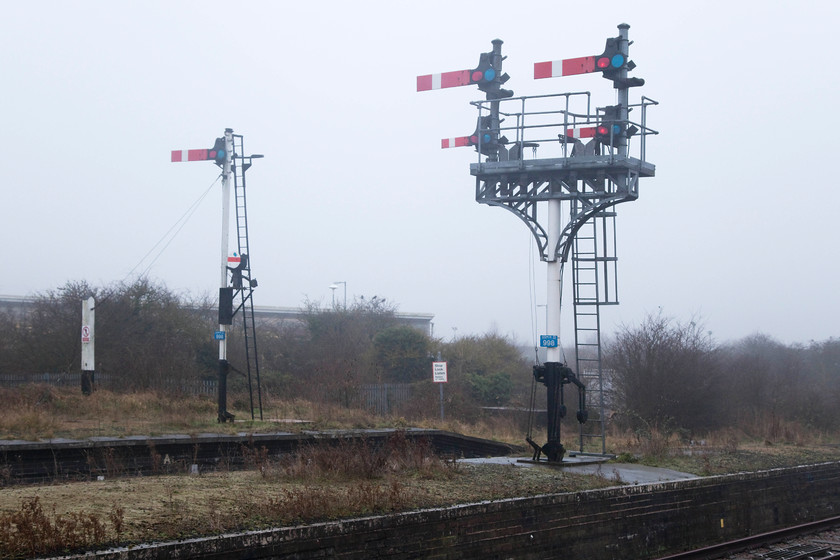 Up starter signals, Skegness station 
 The impressive up starter signals at Skegness. The one to the left sees infrequent use as the platform is largely out of use but for the occasional special. The four-arm bracket in the centre is complete with subsidiary arms below. These are used to allow a train to pass the main arm at danger. In this case, to allow for the once prolific number of excursion trains to draw out of the station and enter the carriage sidings beyond the station. These carriage sidings have been dramatically rationalised in recent years. 
 Keywords: Up starter signals, Skegness station