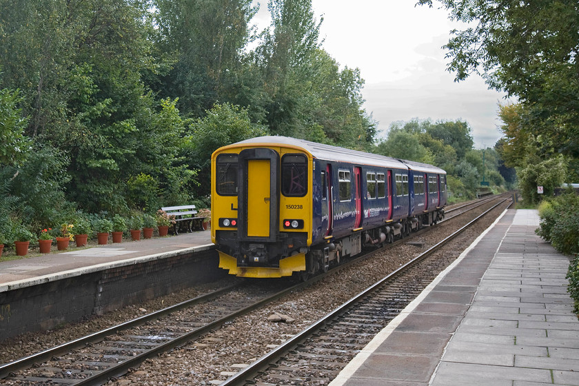 150238, GW 13.10 Weymouth-Gloucester (2E24), Bradford-on-Avon station 
 150238 leaves Bradford-on-Avon station working the 2E24 13.10 Weymouth to Gloucester service. Since I spent my misspent youth on this station collecting numbers in the late 1970s with the tree growth around the station has been the most notable change, apart from the motive power obviously! In a similar view taken in 1977 the scene is far more open, see..... https://www.ontheupfast.com/p/21936chg/23615751604/x50027-bradford-avon-station-paddington 
 Keywords: 150238 13.10 Weymouth-Gloucester 2E24 Bradford-on-Avon station FGW First Great Western