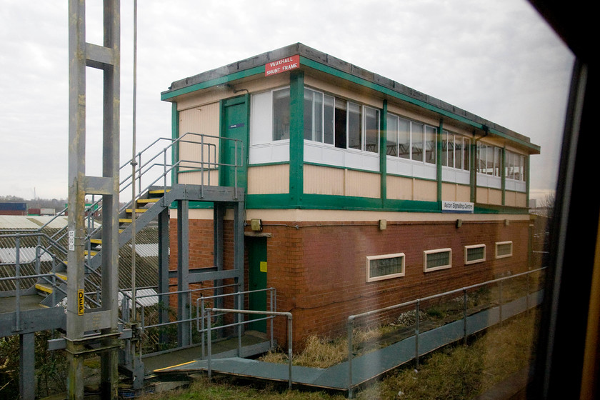 Aston Signalling Centre signal box (ex Vauxhall Shunt Frame) (BR, 1957) 
 This is one box that I will probably not be able to get a better picture of than this! It is high up on an embankment in a pretty impossible spot to get access to. Built by British Railways in 1957 and named Vauxhall Shunt Frame it was renamed to Aston Signalling Centre in 1992 when half the first floor was divided off and a panel was installed to control the Lichfield line. The original 1957 20-lever frame is allegedly still in place. The box can be seen from trains as they enter New Street from the Coventry direction by looking north across the Landor Street Freightliner terminal.

Further to my comments above, I did manage to revisit the signal box and get another picture, as to whether it is a better one I will let you decide, see..... https://www.ontheupfast.com/v/photos/21936chg/27364402804/aston-signalling-centre-signal-box 
 Keywords: Aston Signalling Centre signal box Vauxhall Shunt Frame BR 1957