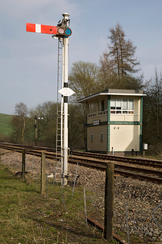 Chapel-en-le-Frith signal box (BR, 1957) 
 Chapel-en-le-Frith signal box is a relatively, modern British Railways (LMR) type 15 structure dating from 1957. It contains a twenty lever frame but has only five levers in use today with the remainder painted white and out of use. It was built to replace the LNWR box that was destroyed in a fatal accident that destroyed it the same year, see.... https://www.railwaysarchive.co.uk/docsummary.php?docID=290 This box is an intermediate block between Buxton and Furness Vale and can often be found switched out but not on this day with both the up and down signals at danger. 
 Keywords: Chapel-en-le-Frith signal box