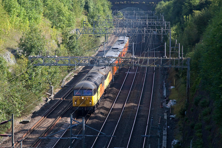 56113, 56087, DR73906, DR73907 & DR73910, 14.17 Bletchley CS-Guide Bridge (6Z56), Roade Cutting 
 Colas livered 56113 and 56087 tow three track machines through Roade Cutting. An unusual working running as the 6Z56 14.17 Bletchley to Guide Bridge involved the movement of DR73906, DR73907 and DR73910. It's good to see that these class 56s still have a useful role to play on the modern railway. Despite their far from good introduction they have matured into good machines. 
 Keywords: 56113 56087 DR73906 DR73907 DR73910 14.17 Bletchley CS-Guide Bridge 6Z56 Roade Cutting