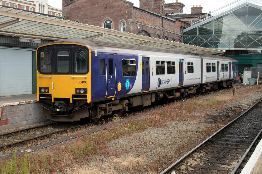 150106, stabled, Chester station 
 Northern's 150106 stands stabled at Chester station awaiting its next turn. The last time that I saw and photographed 150106 was back in the summer of 2017 at a very different location to here in the northwest, see.... https://www.ontheupfast.com/p/21936chg/24717818804/x57602-08-22-penzance-penzance-mpd Perhaps, with new units about to be introduced that will replace these ageing trains this will be the last time that I will photograph it? 
 Keywords: 150106 Chester station Northern