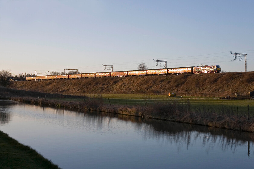 86259, outward leg of The Cumbrian Mountain Express 2, 07.06 London Euston-Carlisle (1Z86), Whilton Locks SP619640 
 Making for a fine site in the early morning sunshine 86259 'Les Ross/Peter Pan' leads The Cumbrian Mountain Express 2 charter running as 1Z86 approaching the Northamptonshire village of Whilton. Unfortunately, there were no narrow boats on this section of the Grand Union Canal as the train passed, something that would have set the photograph off nicely! 
 Keywords: 86259 The Cumbrian Mountain Express 2 07.06 London Euston-Carlisle 1Z86 Whilton Locks SP619640 Les Ross Peter Pan