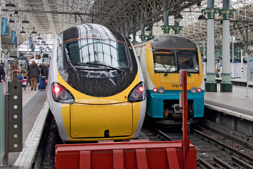 390152, VT 11.20 London Euston-Manchester Piccadilly (1H21, 2L) & 175111, AW 13.31 Manchester Piccadilly-Tenby (1V55, 5L), Manchester Piccadilly station 
 Wreaking of fresh, new paint, 39152 stands at the blocks at Manchester Piccadilly having arrived with the 11.20 from Euston. It is in its new 'nude' livery devoid of any colour or branding on its flanks. This treatment has been afforded to an increasing number of the Pendolinos as a precursor to Virgin franchise expiring at the beginning of December. My wife and I travelled on this service from Milton Keynes. On the adjacent platform eight 175111 is just leaving with the 13.31 to Tenby. 
 Keywords: 390152 11.20 London Euston-Manchester Piccadilly 1H21 175111 13.31 Manchester Piccadilly-Tenby 1V55 Manchester Piccadilly station