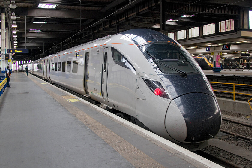 805003, 12.19 London Euston-Crewe (5Q32, 5E), London Euston station 
 My first view of an AT300 class 805 unit! I had missed several chances to photograph the testing of these trains so was pleased when a southbound example passed us whilst we were waiting to pass from the up slow to the up fast at Ledburn Junction just south of Leighton Buzzard. On arrival at Euston, I left my wife for a few minutes and went in search of it finding it at the extreme west of the station on platform sixteen. It was ready to work back north as the 5Q38 12.19 Euston to Crewe but was in fact only going as far as Stafford. The four-car units were supposed to have been in service nearly a year ago but the usual delays (COVID was heavily blamed as it has been for so many things!) have held things up. Notice the Voyager, 221108, that will be replaced by the AT300 waiting in the background. Interestingly, the lady standing to the left commented to me how much better these are when compared to the Voyagers but there are over twenty years between them I suppose! 
 Keywords: 805003 12.19 London Euston-Crewe 5Q32 London Euston station Avanti West Coast AT300