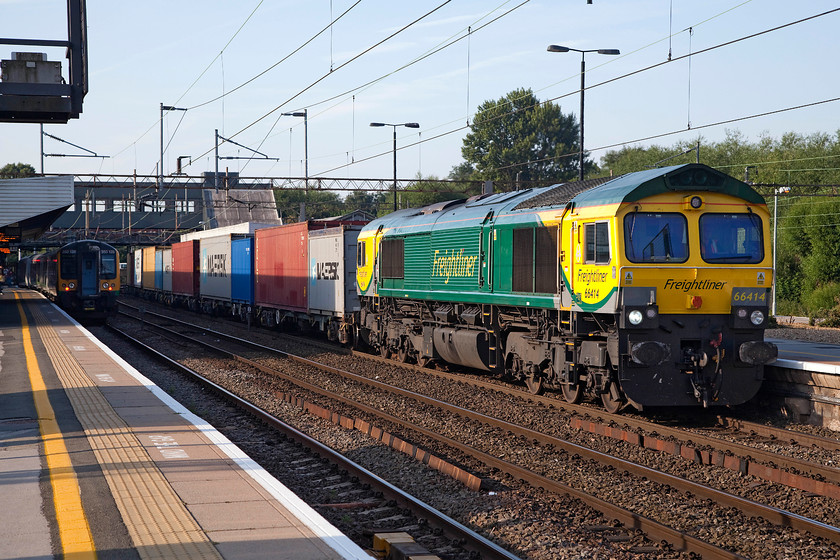 66414, 02.57 Felixstowe North-Ditton (4M45) & 350128, LM 06.54 Birmingham New Street-London Euston (2Y52), Northampton station 
 Freightliner's 66414 brings the 4M45 02.57 Felixstowe to Ditton through a sunny Northampton station. Waiting at platform one is 350128 that will soon be joined by the 06.54 from Birmingham New Street that will work forward to Euston. 
 Keywords: 66414 02.57 Felixstowe North-Ditton 4M45 350128 06.54 Birmingham New Street-London Euston 2Y52 Northampton station