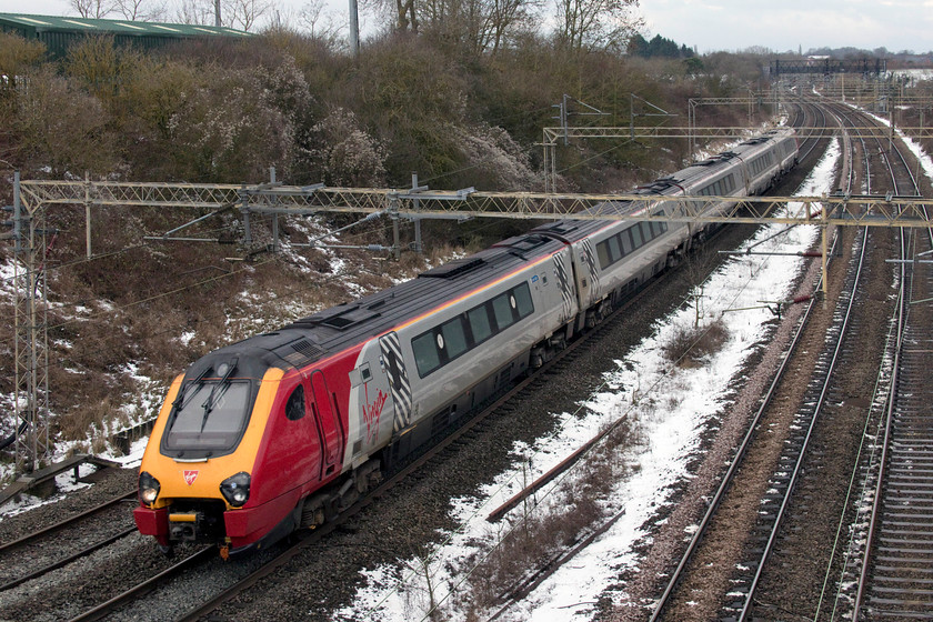 221111, VT 12.35 Chester-London Euston (1A33, 17L), Victoria bridge 
 221111 'Roald Amundsen' forms the 12.35 Chester to London Euston service past Victoria bridge just south of Roade. The cold weather that we were experiencing at the time this picture was taken would have been shorts and T-shirt weather for an explorer such as Roald Amundsen who was the first to get to the South Pole in 1911 beating our own Captain Scott in the process. 
 Keywords: 221111 12.35 Chester-London Euston 1A33 Victoria bridge