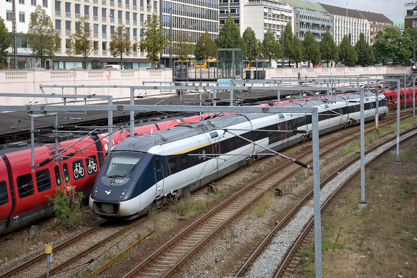 5630, unidentified working, Ved Vesterport bridge 
 One of the notoriously unreliable Italian AnsaldoBreda built IC4 units passes an S-Line train at Vesterport station on the approaches to Copenhagen Central station. I was not able to identify what service set 5630 was working. 
 Keywords: 5630 Ved Vesterport bridge