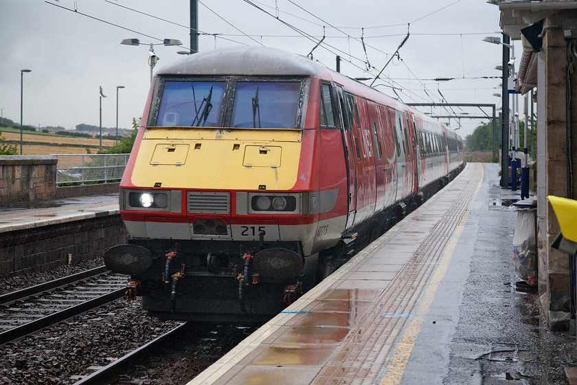 82215, GR 11.00 Edinburgh Waverley-London King`s Cross (1E12, 8L), Prestonpans station 
 DVT 82215 leads the LNER 11.00 Edinburgh Waverley to King's Cross through Prestonpans station. It was absolutely pouring with rain at this point, so much so that the drive for the next few miles along the A198 was taken at a sedate pace due to the huge amounts of lying water on the carriageway. 
 Keywords: 82215 11.00 Edinburgh Waverley-London King`s Cross 1E12 Prestonpans station