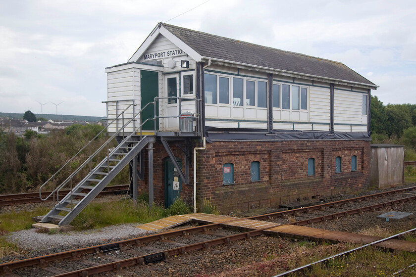 Maryport Station signal box (LMS, 1933) 
 The second box along the Cumbrian coast route from Carlise is Maryport. The box is a rather grand LMS structure dating from 1933. Today, I suspect that there are more white levers in the box than of any other colour with it controlling very little compared with what it did in the past. When I photographed the box back in 1984 it looked very different to this with no ugly UPVC panelling disfiguring it. Like Wigton station a little earlier, Maryport station was once a very grand affair with a large station building and overall roof in keeping with the large numbers of Victorians and Edwardians that visited the seaside resort for their holidays. 
 Keywords: Maryport Station signal box LMS 1933