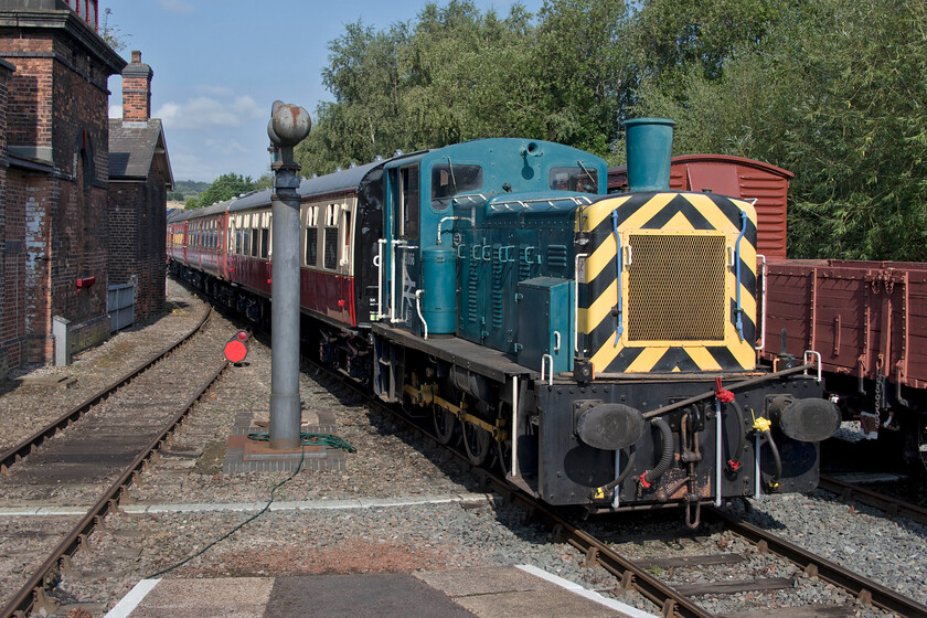 03066, shuttle train, Barrow Hill Roundhouse 
 Shuttle services were in operation at the Barrow Hill open day(s) throughout the day. They took passengers the short distance to the extreme of the headshunt and back, a total distance of about a mile. Andy and I took this train seen here arriving at Barrow Hill's small platform. The outward leg was hauled by former GWR 0-6-0 pannier tank 1501 (out of sight in this view) with the return leg by 03066. 
 Keywords: 03066 shuttle train Barrow Hill Roundhouse