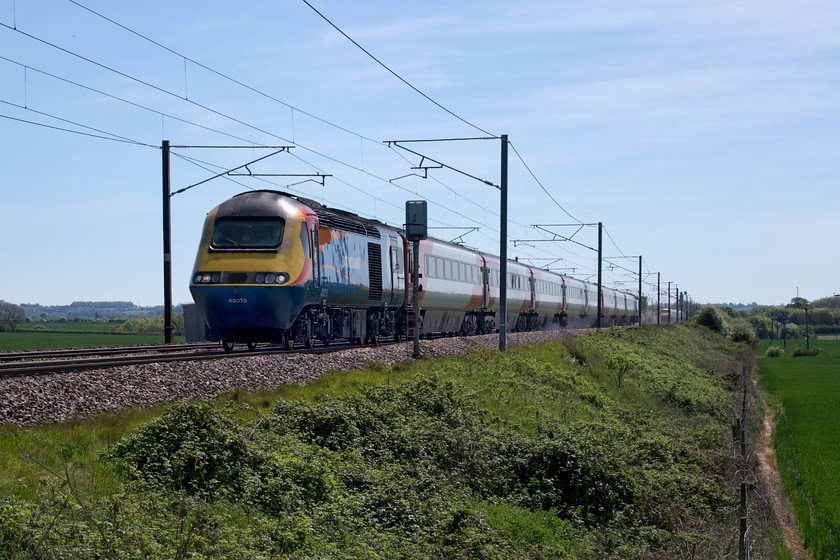 43075, GR 11.33 London King`s Cross-Leeds (1D12, 1L), Frinkley Lane crossing SK906436 
 On hire from East Midlands Trains, 43075 leads the 11.33 King's Cross to Leeds past Frinkley Lane crossing in remote west Lincolnshire just north of Barkston Junction. Close examination of the picture reveals that the toilet in the third coach is being flushed as witnessed by the trail of water and other 'material' emanating from it. The few 'classic' HSTs remaining on the network and sets of heritage stock are the only ones with open emission systems that deposit their waste trackside, a practice that workers really should not have exposure to in 2019. 
 Keywords: 43075 11.33 London King`s Cross-Leeds 1D12 Frinkley Lane crossing SK906436