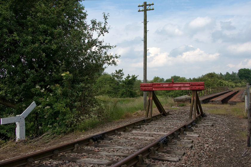 The end of the line, bridge 14, Merry Tom Lane 
 This is the current northern limit of the Northampton and Lamport Railway. Beyond the buffers is bridge 14 that requires a lot of work before the track can be laid and trains allowed to cross. The NLR has ambitions to open an extension to Merry Tom Lane a short distance beyond the photograph. The line's current focus is on their southern extension to Boughton crossing where a new station is being built. At the time of writing, bridge 11 is closed for re-proofing, the final barrier preventing the southern extension opening. 
 Keywords: The end of the line, bridge 14 Merry Tom Lane