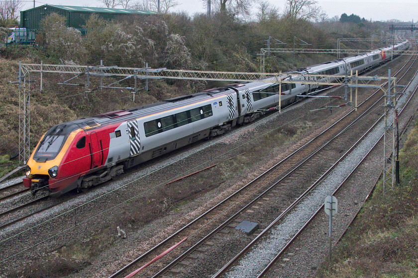 221143 & 221106, VT 08.54 Edinburgh Waverley-London Euston (9M52, 1E), Victoria bridge 
 The race to photograph the former Virgin Voyagers on the WCML is now off for the moment as Avanti has paused its programme to replace them with bi-mode units. I am not sure if Avanti has plans to re-livery the units as they are still unbranded and wear Virgin's colours over a year after the operator ceased its operations. 221143 and 221106 work the 9M52 08.54 Edinburgh to Euston on what is surely the most inefficient route on which to operate a pair of thirsty diesel units! 
 Keywords: 221143 221106, VT 08.54 Edinburgh Waverley-London Euston 9M52 Victoria bridge