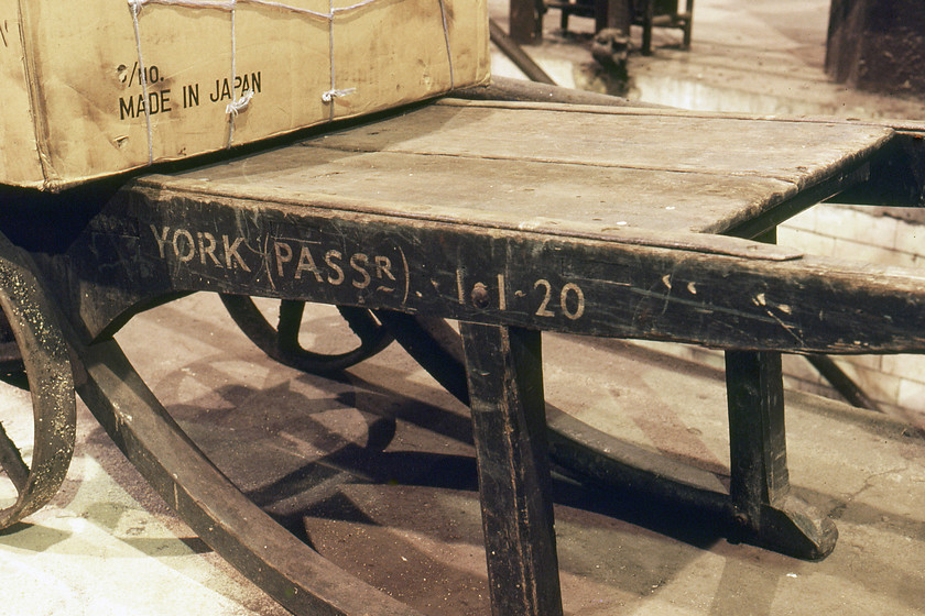 Sack barrow (01.01.20), York station 
 When this photograph was taken in 1980 this sack truck on York station was already sixty years old and still in use. The delightful piece of platform infrastructure has a robust and timeless design and, if it could talk would be able to tell an incredible story of the changes it will have witnessed on York station since January 1920. I wonder what was in the box that was 'Made in Japan'? 
 Keywords: Sack barrow York station