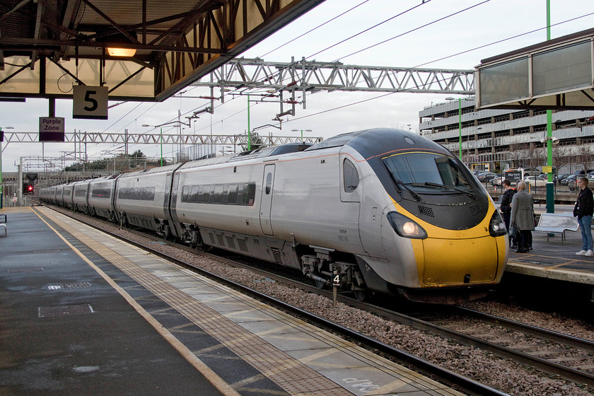 390135, VT 09.10 Birmingham New Street-London Euston (1B48, 2L), Milton Keynes Central station 
 390135 'City of Lancaster' heads south through Milton Keynes Central station forming the 09.10 Birmingham New Street to Euston service. Whilst the Pendolino still carries its City of Lancaster name, the traditional cast plate was removed some time ago to be replaced by a poor vinyl version, not surprising given that the whole train has been debranded in preparation for Avanti West Coast taking over the franchise. 
 Keywords: 390135 09.10 Birmingham New Street-London Euston 1B48 Milton Keynes Central station Virgin Trains City of Lancaster