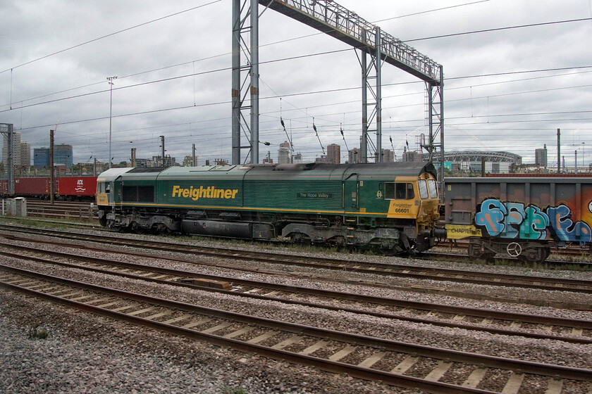 66601, 13.20 Willesden-Tunstead (6H50, 6E), Wembley Yard 
 66601 'The Hope Valley' is returning to its namesake leading the 6H50 13.20 Willesden to Tunstead empty stone wagons. The train is seen waiting to leave Wembley Yard about an hour after this photograph was taken. Notice the leading cab of the Freightliner Class 66 completely festooned in limestone dust probably from its last visit to the quarries 
 Keywords: 66601 13.20 Willesden-Tunstead 6H50 Wembley Yard The Hope Valley