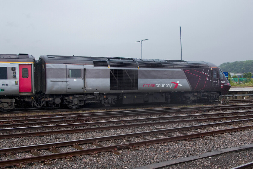 43239, XC 06.06 Edinburgh Waverley-Plymouth (1V50, 9L), Bristol Temple Meads station 
 The leading power car of the 06.06 Edinburgh Waverley to Plymouth service stands in the rain at Bristol Temple Meads. 43239 is a former LNER East Coast power car originally numbered E43039 that started its operational life back in 1977. It now has a few weeks left in operation with CrossCountry who will be withdrawing their HSTs at the end of the summer returning them to Angel Trains who will probably scrap them; an ignominious end for an icon of the railways! 
 Keywords: 43239 06.06 Edinburgh Waverley-Plymouth 1V50 Bristol Temple Meads station CrossCountry HST