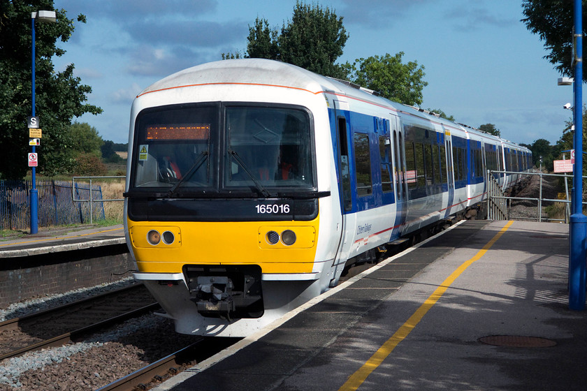 165016 & 165030, CH 09.44 Banbury-London Marylebone, (1H14, 5L), Kings Sutton station 
 The 09.44 Banbury to London Marylebone slows for its stop at King's Sutton. This service was being worked by 165016 and 165030 that my wife, son and I travelled on to London. This is not our usual route to the capital living very close to the WCML, but, as Euston was closed for extensive engineering works at the northern end of Wembley Yard we had to make alternative arrangements. 
 Keywords: 165016 165030 1H14 Kings Sutton station