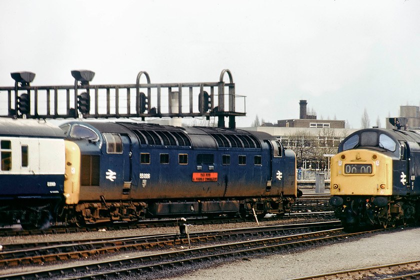 55006, ECS & 40101, stabled, York MPD 
 Using my telephoto lens on the Zenith EM has compacted things slightly outside of York station from the MPD. The picture shows 55006 ' The Fife and Forfar Yeomanry' at the head of an ECS working easing into York station. It is passing 40101 that is stabled on the depot. 
 Keywords: 55006 40101 stabled York MPD