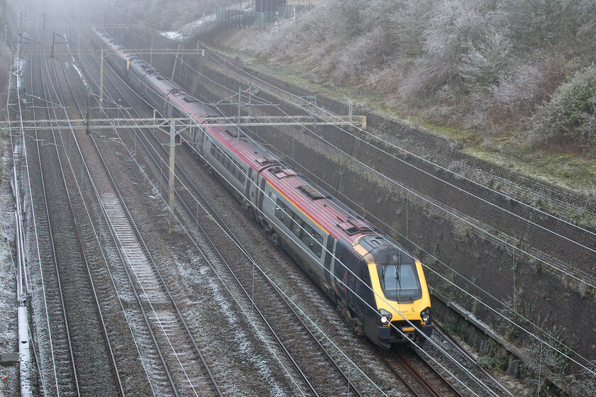 221103 & 221105, VT 10.03 Wolverhampton-London Euston (1B35, 6L), Roade cutting 
 The plan was that by now the Class 221 Voyagers should have been confined to history on the WCML route. However, as is all too tragically the case considerable slippage has meant that the planned withdrawal has been put back. With the replacement Class 805 bi-mode units undergoing testing I suspect that the long-awaited transition will be sometime in the late spring. 221103 and 221105 head south through a frosty Roade cutting on the low line having been diverted via Northampton with the 10.03 Wolverhampton to Euston service.

Note - later in the day that I wrote this I read in Rail that the first Voyager (221162) had been moved to storage at Worksop after coming off-lease and facing a very uncertain future. 
 Keywords: 221103 221105 10.03 Wolverhampton-London Euston 1B35 Roade cutting AWC Avanti West Coast