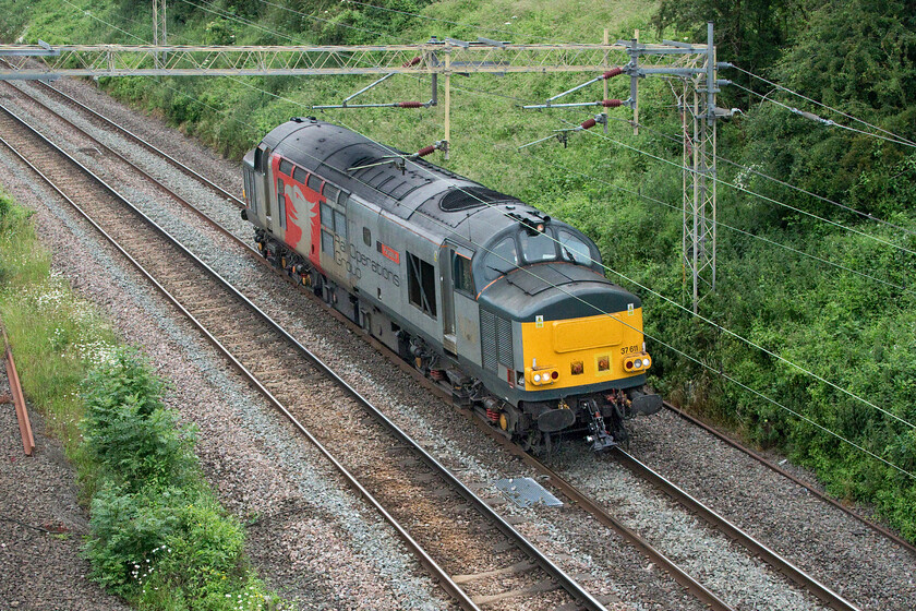 37611, 09.15 Derby RTC-Wembley Yard (0H73, RT), Victoria bridge 
 I had noticed the 0H73 light engine move on RTT earlier in the morning and that it had been activated. It made good progress and was actually being allowed to run ahead of schedule until it got to Northampton. 37611 'Pegasus' is seen passing Victoria bridge just south of Roade as the 09.15 Derby to Wembley Yard. This locomotive is coming up for sixty years old (rather like myself!) and yet is still looking smart and earning its keep on the national network. Twenty seconds later, another veteran of the tracks came the other way....... https://www.ontheupfast.com/p/21936chg/30015978482/x2-47749-360108-08-22-cricklewood 
 Keywords: 37611 09.15 Derby RTC-Wembley Yard 0H73 Victoria bridge ROG Rail Operations Group Pegasus