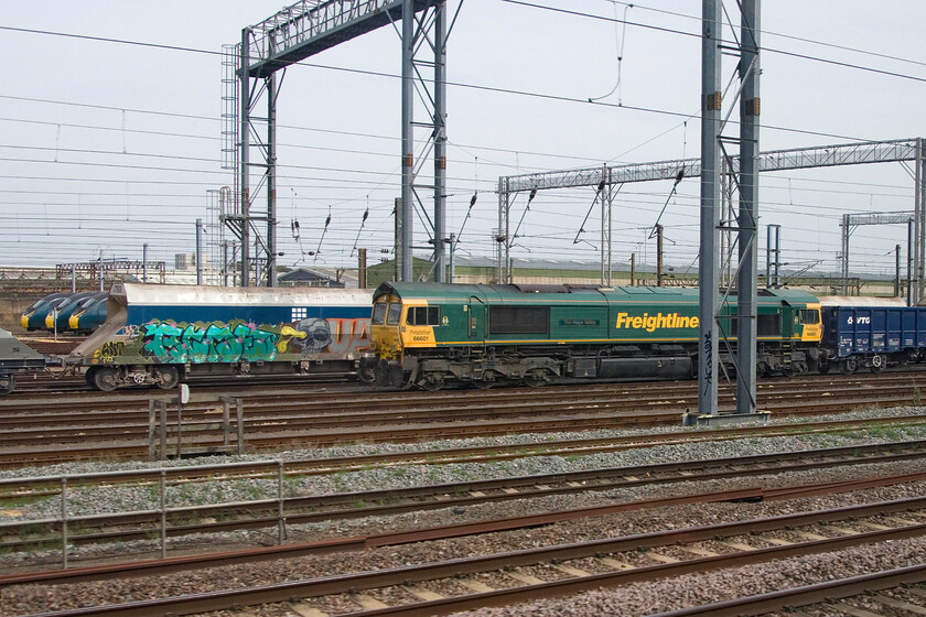 66601, stabled, Wembley Yard 
 66601 is seen in Wembley Yard at the head of a rake of JNA VTG-owned stone wagons. Unfortunately, I could identify this working from RTT and my friend Mie could not find a TOPS report for this day so it will remain a mystery unless anybody else can help. Notice the neatly lined up trio of Pendolinos stabled to the extreme left of the photograph. 
 Keywords: 66601 stabled Wembley Yard