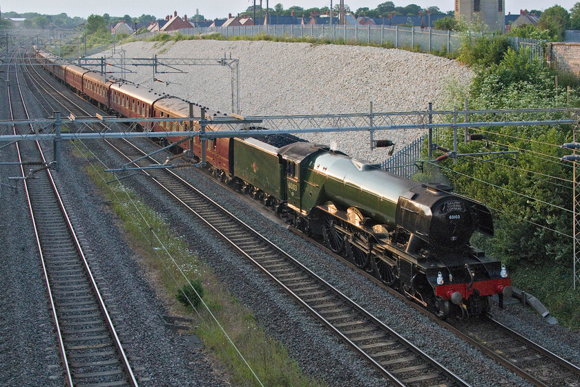 60103, return leg of The Cheshireman, 15.40 Chester-London Euston (1Z41, 5L), Ashton Road bridge 
 After the almost rabid scenes of excitement from earlier in the day, the return Cheshireman charter from Chester to Euston hauled by 60103 'Flying Scotsman' saw nobody else (near me at least) out to witness the event. Just catching the last of the day's sun at 20.00 the 1Z41 charter is seen from Ashton Road bridge just south of Roade. 
 Keywords: 60103 The Cheshireman 15.40 Chester-London Euston 1Z41 Ashton Road bridge Flying Scotsman 4472